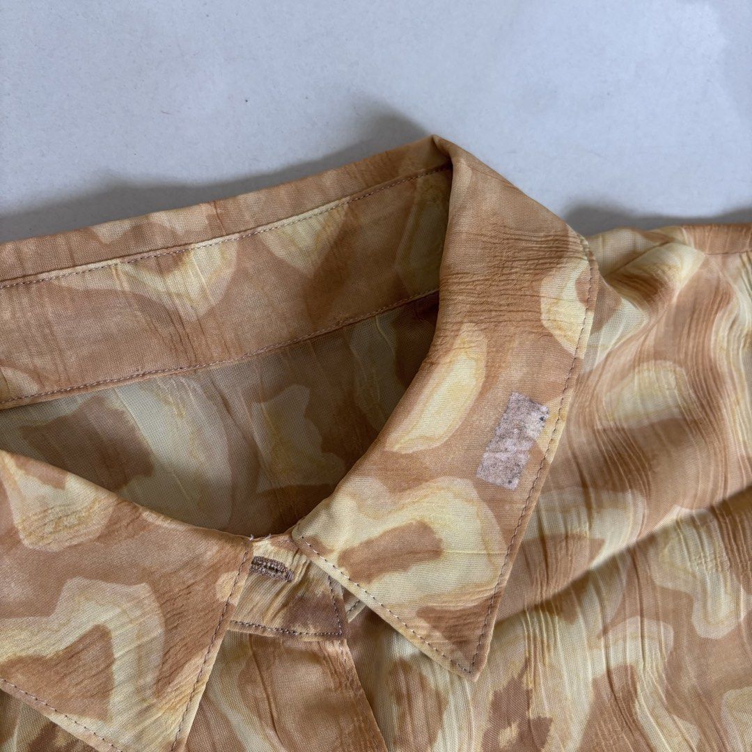 yellow floral sheer button up shirt (Category: Blouses) located in Quezon City. Submitted by yamakento (Listing ID 1471144965, Image 3). Description: fits s-m; with flaw (3rd pic).