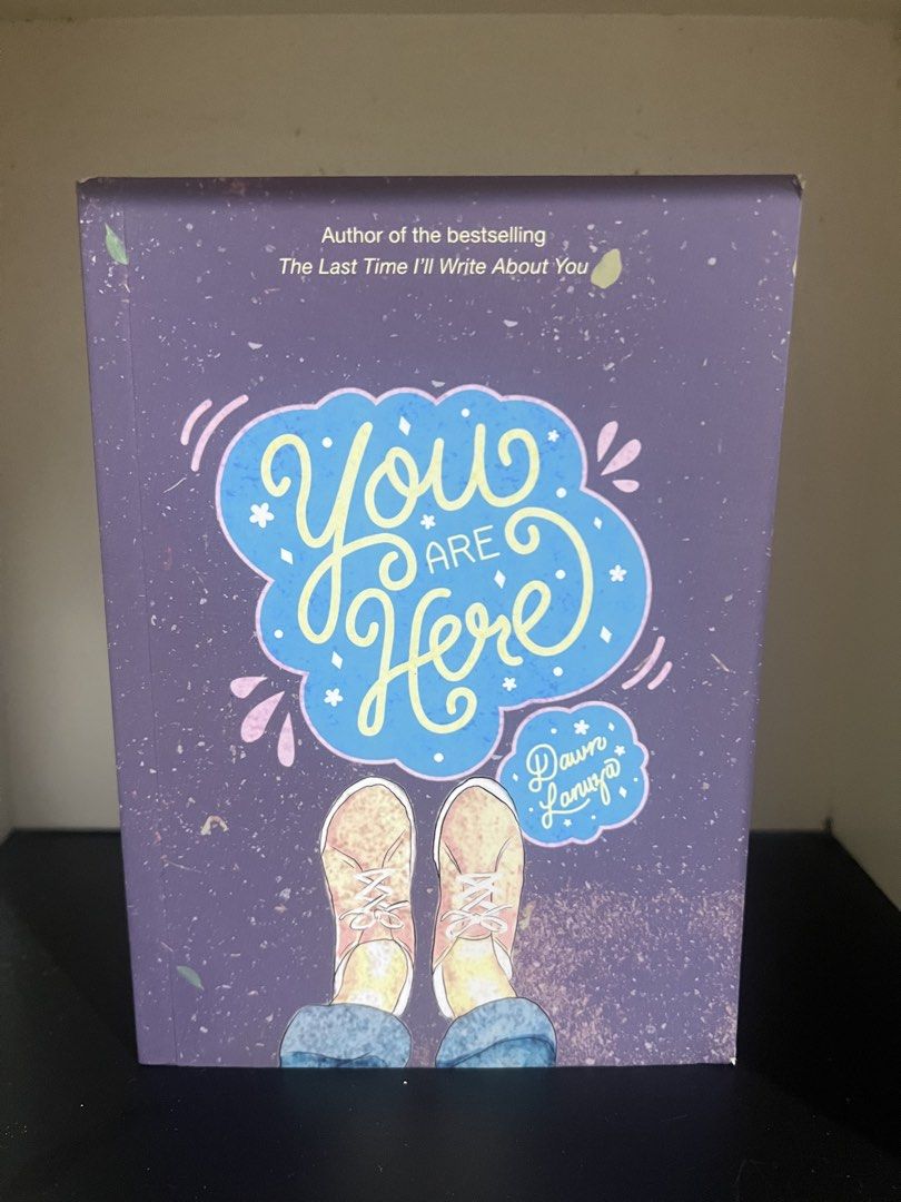 You Are Here by Dawn Lanuza (Category: Storybooks) located in Makati City. Submitted by foundbychance (Listing ID 1471238935, Image 1). Description: - Title: You Are Here by Dawn Lanuza - Publisher: Andrews McMeel Publishing - Edition: National Book Store (NBS) Exclusive - Features: Includes bonus poem and art - Design: Purple cover with colourful typography and sneaker illustration - Condition: Clean copy with original NBS price tag on the back.