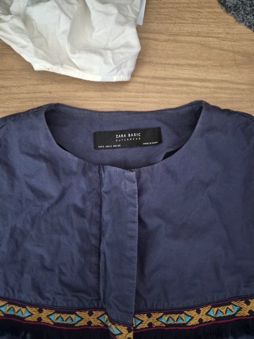 Zara Basic Navy Blue Embroidered Bell Sleeve Jacket (Category: Coats, Jackets and Outerwear) located in Cavite. Submitted by frombellas (Listing ID 1471222662, Image 3). Description: - Brand/Model: Zara Basic Outerwear - Color: Dark Navy Blue - Size: S - Design: Eye-catching chest embroidery with fringe trim - Features: Flared bell sleeves, front pockets, and open front with snap button closure - Material: Lightweight, ideal for layering in trans