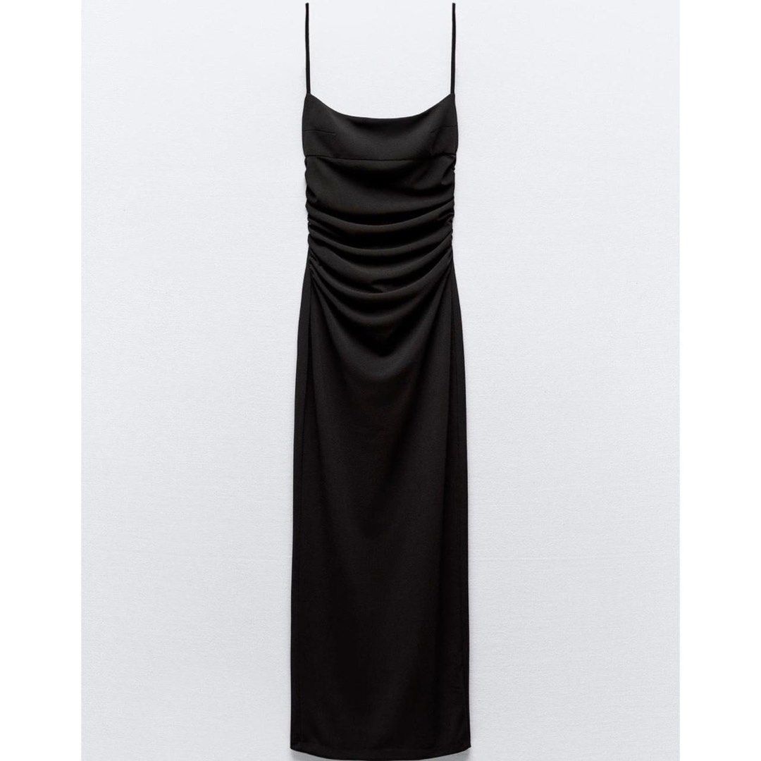 ZARA Black Ruched Midi Dress Spaghetti Strap (Category: Dresses) located in Cagayan de Oro. Submitted by sexydoll.ph (Listing ID 1471186019, Image 1). Description: - Color: Classic black - Style: Fitted midi dress with a sleek silhouette - Details: Trendy square neckline, delicate spaghetti straps, and all-over front ruching - Length: Mid-calf - Fabric: Smooth with a slight stretch for comfort - Occasion: Ideal for evening events, dates, or night