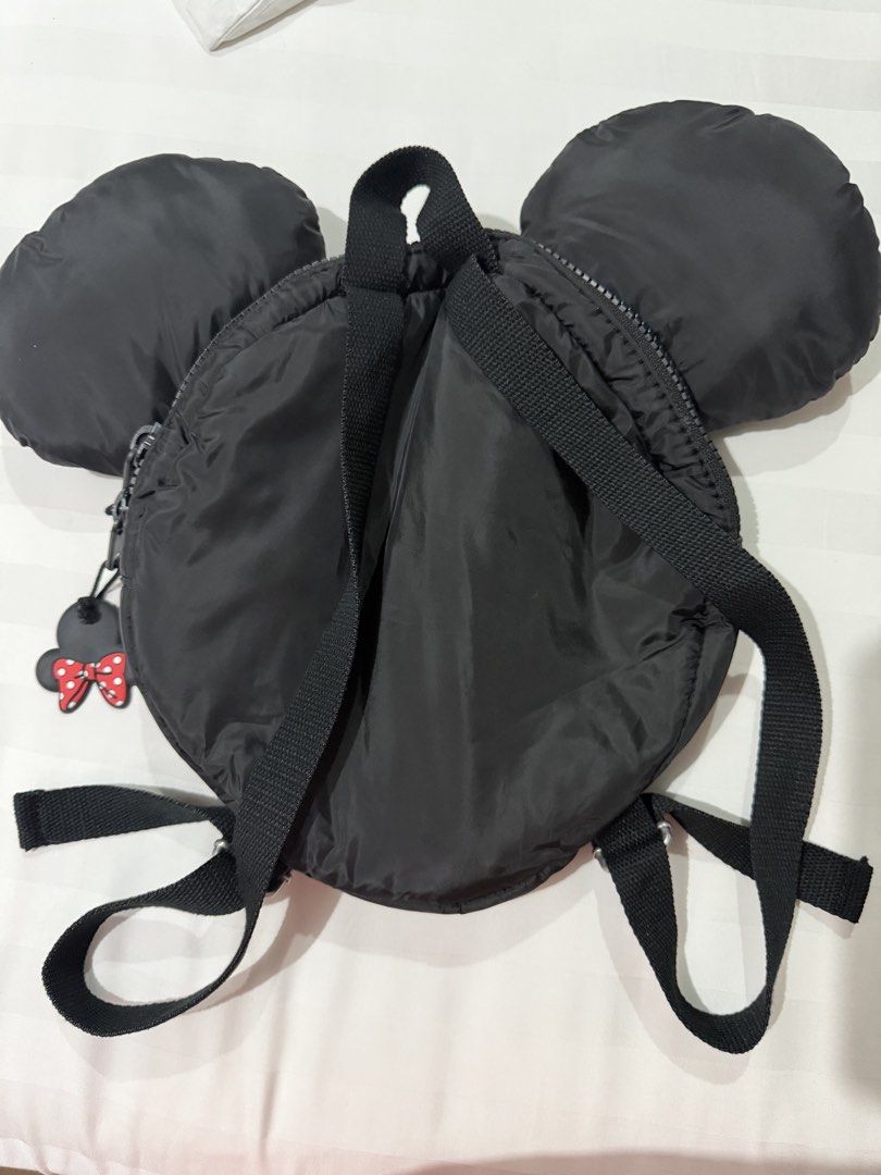 Zara Disney Mickey Mouse Minnie Black Puffer Mini Backpack (Category: Babies & Kids Fashion) located in Marikina City. Submitted by kscanlas12 (Listing ID 1471248436, Image 2). Description: - Brand: Zara Disney - Design: Black puffer mini backpack with Mickey Mouse ears - Details: Minnie Mouse zipper pull with red polka dot bow and silver Mickey head print lining - Features: Adjustable black fabric shoulder straps and top carry handle - Condition