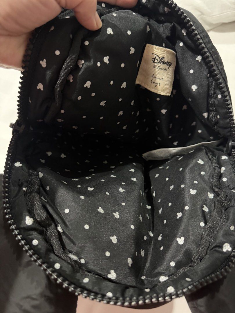 Zara Disney Mickey Mouse Minnie Black Puffer Mini Backpack (Category: Babies & Kids Fashion) located in Marikina City. Submitted by kscanlas12 (Listing ID 1471248436, Image 3). Description: - Brand: Zara Disney - Design: Black puffer mini backpack with Mickey Mouse ears - Details: Minnie Mouse zipper pull with red polka dot bow and silver Mickey head print lining - Features: Adjustable black fabric shoulder straps and top carry handle - Condition