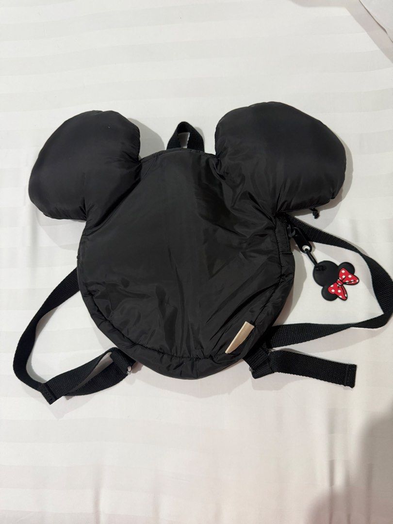 Zara Disney Mickey Mouse Minnie Black Puffer Mini Backpack (Category: Babies & Kids Fashion) located in Marikina City. Submitted by kscanlas12 (Listing ID 1471248436, Image 1). Description: - Brand: Zara Disney - Design: Black puffer mini backpack with Mickey Mouse ears - Details: Minnie Mouse zipper pull with red polka dot bow and silver Mickey head print lining - Features: Adjustable black fabric shoulder straps and top carry handle - Condition