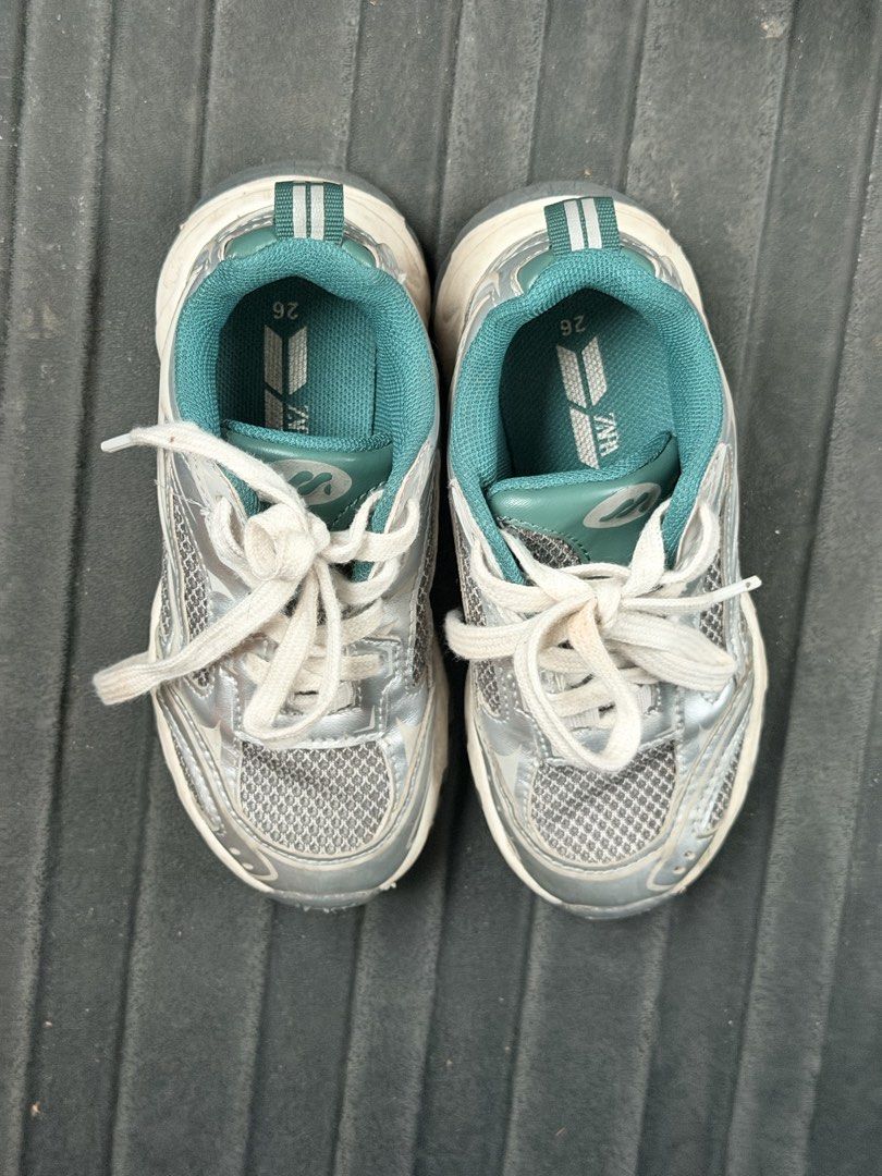 ZARA Kids Sneakers Size 26 (Category: Babies & Kids Fashion) located in Bacolod City. Submitted by yel.pvt (Listing ID 1471141585, Image 2). Description: - Brand: Zara - Style: Children's trainers / sneakers - Size: 26 (printed on insole) - Color: Metallic silver with turquoise green lining and dual-stripe heel pull tabs - Sole: Chunky white soles - Condition: Great everyday footwear with some normal dirt and discoloration on the white laces, cou