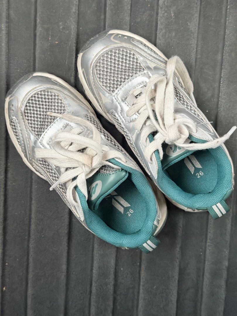 ZARA Kids Sneakers Size 26 (Category: Babies & Kids Fashion) located in Bacolod City. Submitted by yel.pvt (Listing ID 1471141585, Image 1). Description: - Brand: Zara - Style: Children's trainers / sneakers - Size: 26 (printed on insole) - Color: Metallic silver with turquoise green lining and dual-stripe heel pull tabs - Sole: Chunky white soles - Condition: Great everyday footwear with some normal dirt and discoloration on the white laces, cou