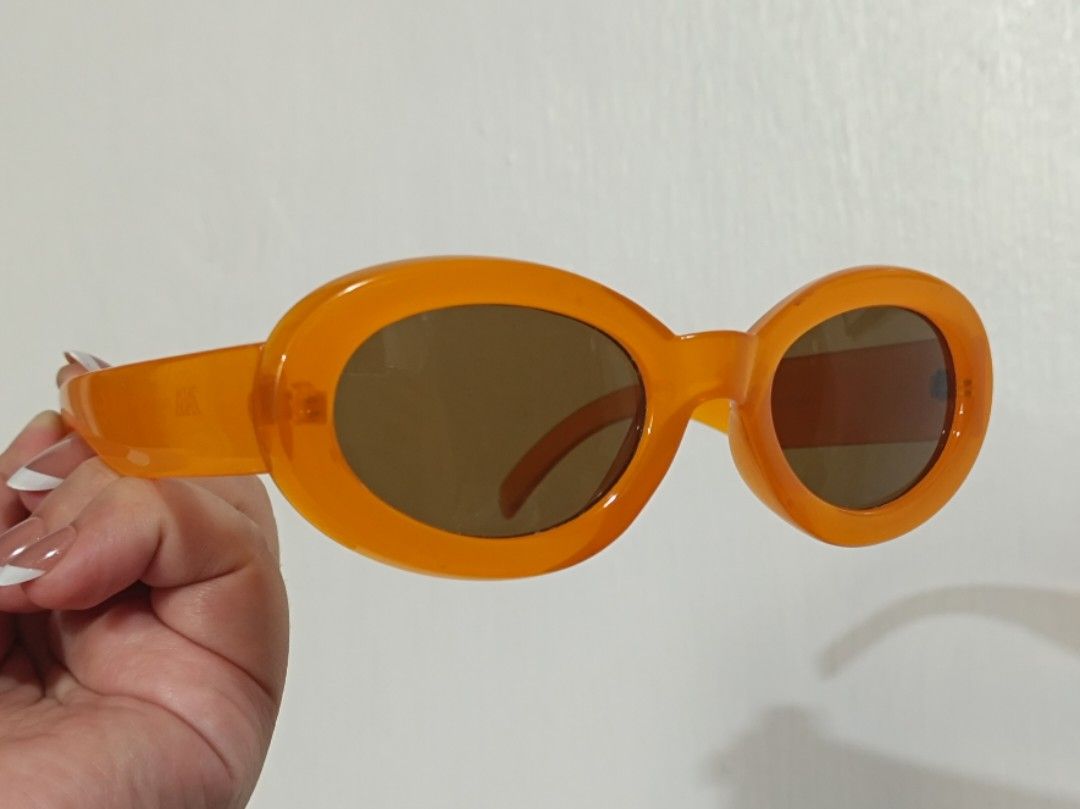 ZARA Orange Oval Sunglasses (Category: Sunglasses & Eyewear) located in Quezon City. Submitted by pumpkinspice08 (Listing ID 1471167340, Image 1). Description: no glasses case. barely used. minor scratches. Bright orange oval sunglasses from Zara. Chunky frames with brown tinted lenses. Fun pop of colour for summer outfits, festivals, or everyday sunny days. Model number 04646 003 615 030 stamped on the arm. Measurements are 51□22-140mm. Clear an