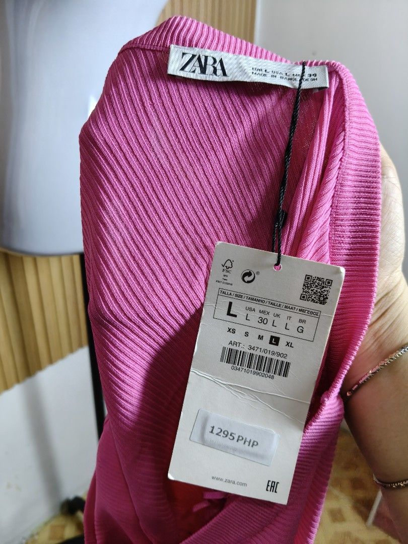 Zara Pink One-Shoulder Ribbed Tank Top (Category: Sleeveless) located in Taguig. Submitted by ashie_clothing (Listing ID 1471256875, Image 3). Description: - Brand: Zara - Size: L (Brand new with original price tag attached) - Color: Vibrant bright pink - Design: Chic one-shoulder neckline with a stretchy ribbed texture - Material: Super comfy and soft - Styling: Great basic piece to pair with high-waisted jeans or skirts.