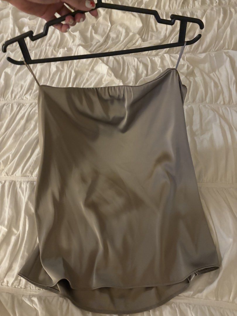 Zara Satin Camisole Top Size S (Category: Sleeveless) located in Makati City. Submitted by audrey.hepburn (Listing ID 1471148671, Image 1). Description: - Brand: Zara - Style: Satin camisole top with spaghetti straps, straight neckline, and slightly curved hem - Color: Taupe - Size: S (EUR/USA tag) - Condition: Brand new with tags attached, never worn - Material: Smooth fabric with a luxurious slight sheen.