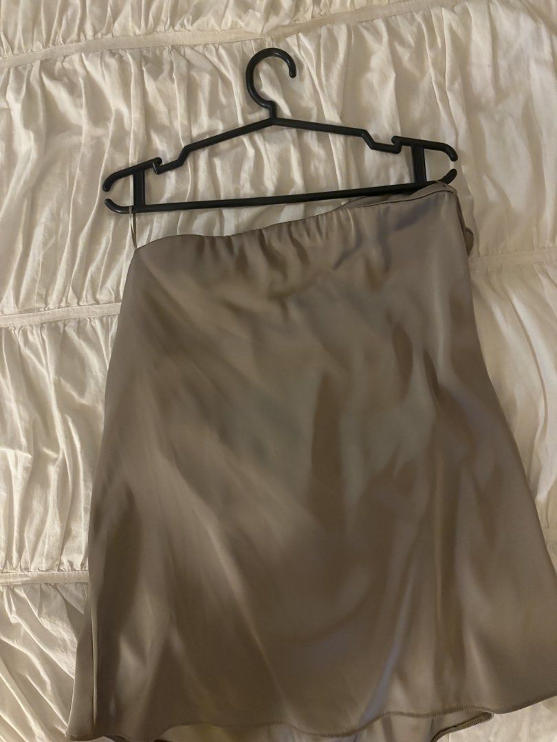 Zara Satin Camisole Top Size S (Category: Sleeveless) located in Makati City. Submitted by audrey.hepburn (Listing ID 1471148671, Image 3). Description: - Brand: Zara - Style: Satin camisole top with spaghetti straps, straight neckline, and slightly curved hem - Color: Taupe - Size: S (EUR/USA tag) - Condition: Brand new with tags attached, never worn - Material: Smooth fabric with a luxurious slight sheen.