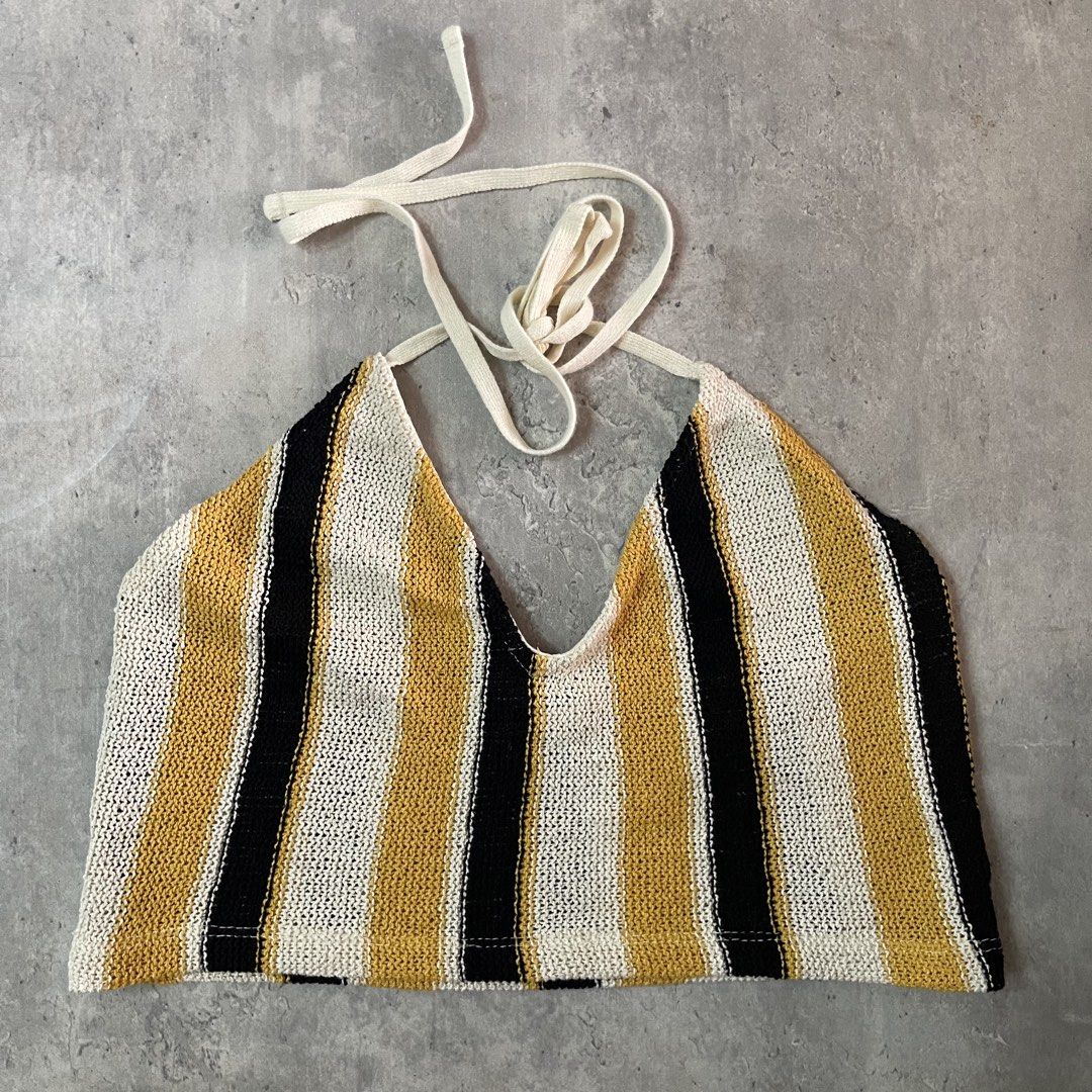 Zara Striped Knit Halter Crop Top (Category: Sleeveless) located in General Trias. Submitted by 1992thelabel (Listing ID 1471137960, Image 3). Description: Decluttering to feed more stray cats and dogs in our subdivision and nearby barangay. Your purchase will be a big help! Thank you so much in advance! - Brand: Zara - Style: Knitted halter crop top with open back and tie-neck straps - Pattern: Vertical stripes in yellow, black, and white - Size