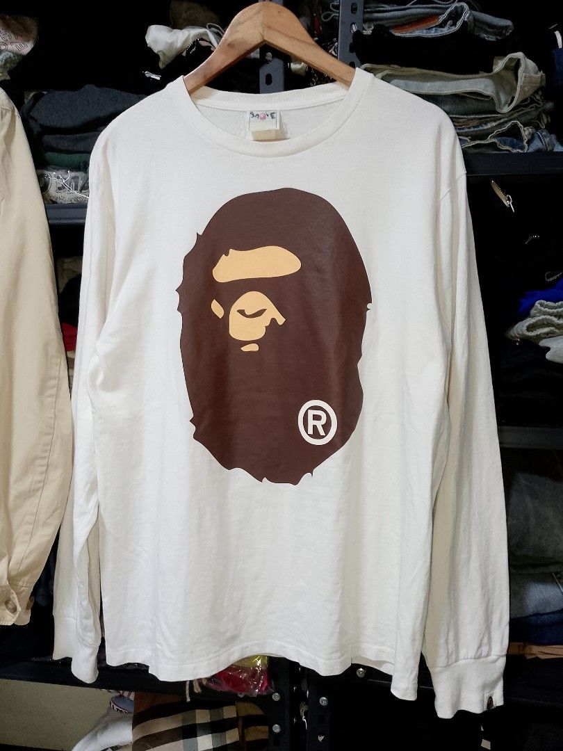 A Bathing Ape (BAPE) Big Ape Head Long Sleeve Tee (Category: Coats, Jackets and Outerwear) located in Manila. Submitted by mjthrifted_second (Listing ID 1471375215, Image 1). Description: A Bathing Ape (BAPE) Big Ape Head Long Sleeve Tee Size Large Dimes 22/28 Excellent Condition No Issue.