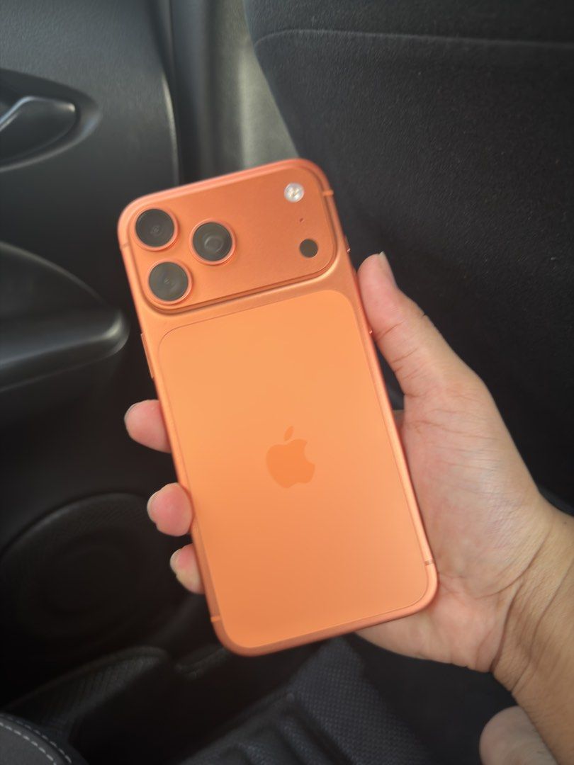 Apple iPhone 17 Pro Max Orange 256GB (Category: iPhone 17 Series) located in Manila. Submitted by nobodddyyy (Listing ID 1471308672, Image 1). Description: Iphone 17 promax 256gb Smartlocked Warranty until may 2027 batt health 100% Minimal dent on upper and lower Complete inclusion with free cases.