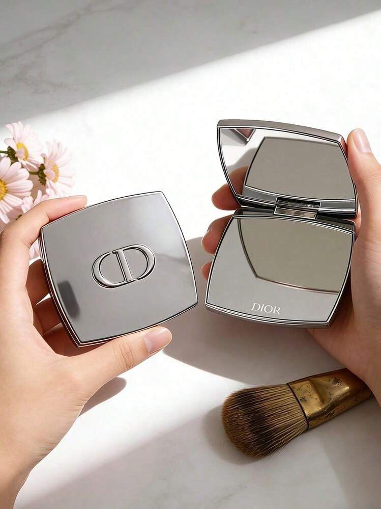 Authentic Christian Dior Square Pocket Mirror (Category: Makeup) located in Manila. Submitted by cheesetinefinds (Listing ID 1471316019, Image 1). Description: - Brand: Christian Dior - Design: Shiny silver finish with raised CD logo on top and engraved logo on the bottom edge - Features: Clear, high-quality mirror inside - Portability: Compact size, fits easily in any bag for quick touch-ups - Inclusion: Comes with original white Parfums Christi