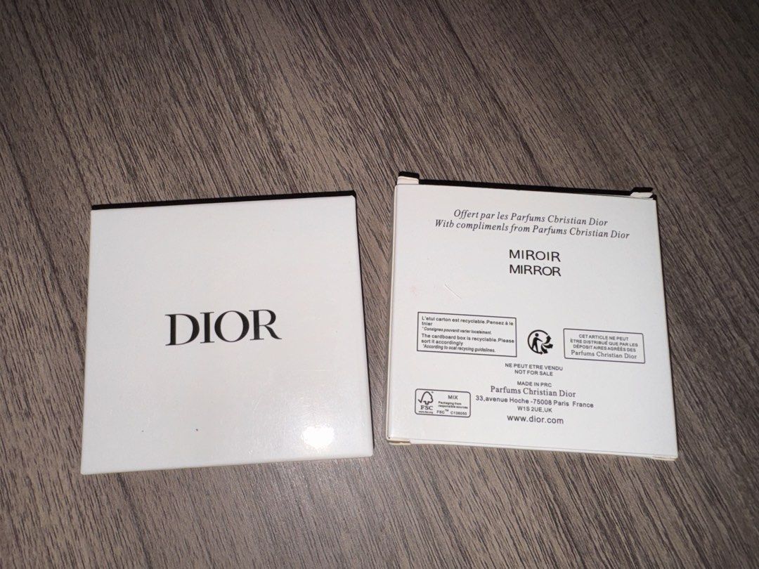 Authentic Christian Dior Square Pocket Mirror (Category: Makeup) located in Manila. Submitted by cheesetinefinds (Listing ID 1471316019, Image 3). Description: - Brand: Christian Dior - Design: Shiny silver finish with raised CD logo on top and engraved logo on the bottom edge - Features: Clear, high-quality mirror inside - Portability: Compact size, fits easily in any bag for quick touch-ups - Inclusion: Comes with original white Parfums Christi