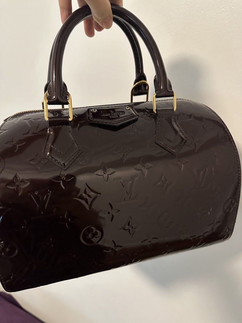 Authentic Louis Vuitton Monogram Vernis Speedy Handbag (Category: Luxury Bags & Wallets) located in Manila. Submitted by pbum168 (Listing ID 1471308682, Image 1). Description: - Authentic Louis Vuitton Alma handbag in stunning Amarante Monogram Vernis leather - Structured bowling silhouette with elegant rolled top handles - Luxurious gold-tone hardware and matching padlock on the zipper - Glossy embossed monogram finish for a timeless look - Incl