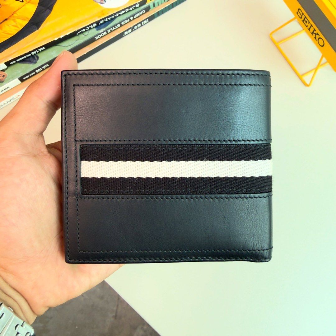 Bally Leather Bifold Wallet with Coin Pocket (Category: Wallets & Card Holders) located in San Isidro, Davao del Norte. Submitted by nikkody226_488 (Listing ID 1471319652, Image 2). Description: BALLY BIFOLD WALLET Black Webbing Calfskin Leather Price: 2,500 Condition: 9/10, well-maintained with minimal signs of use. Comes with original Bally card. Location: Three Groove Subdivision, Dungon, Iloilo Can also be shipped nationwide..