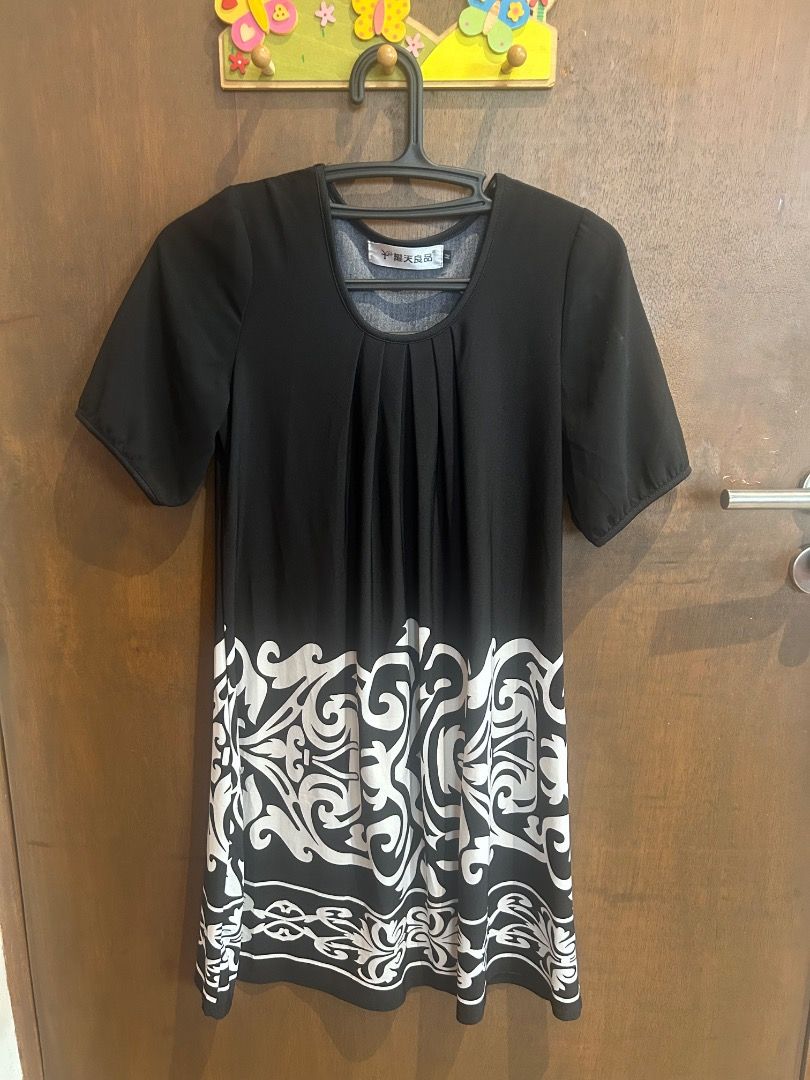 Black and white patterned short sleeve dress (Category: Dresses) located in Quezon City. Submitted by royalturtle.7a28b0 (Listing ID 1471330369, Image 2). Description: - Style: Casual short sleeve mini dress with round neckline - Design: Eye-catching white floral damask pattern on the lower hem and pleated front detail - Fit: Standard sizing, easy pullover style - Comfort: Made from lightweight fabric, ideal for daily wear and weekend outings.