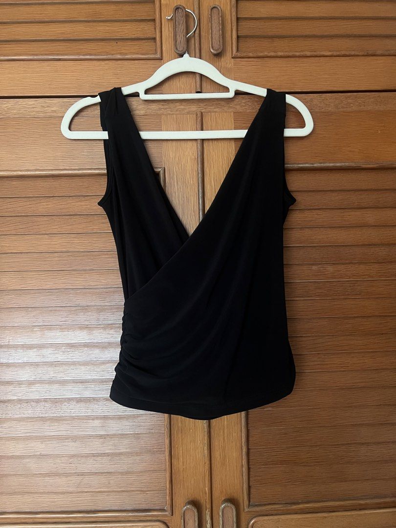 Black sleeveless wrap top with deep V-neck (Category: Sleeveless) located in Manila. Submitted by cheddarph (Listing ID 1471366583, Image 2). Description: .