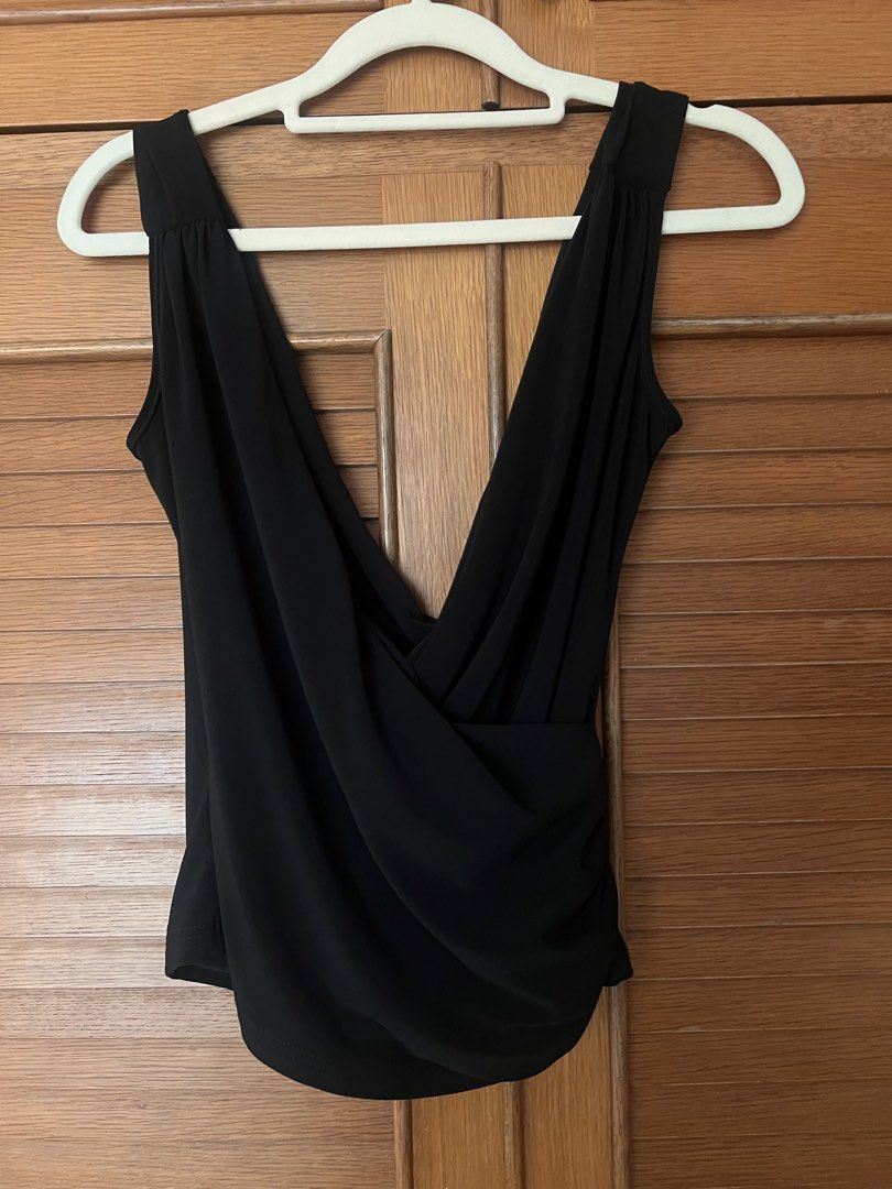 Black sleeveless wrap top with deep V-neck (Category: Sleeveless) located in Manila. Submitted by cheddarph (Listing ID 1471366583, Image 3). Description: .