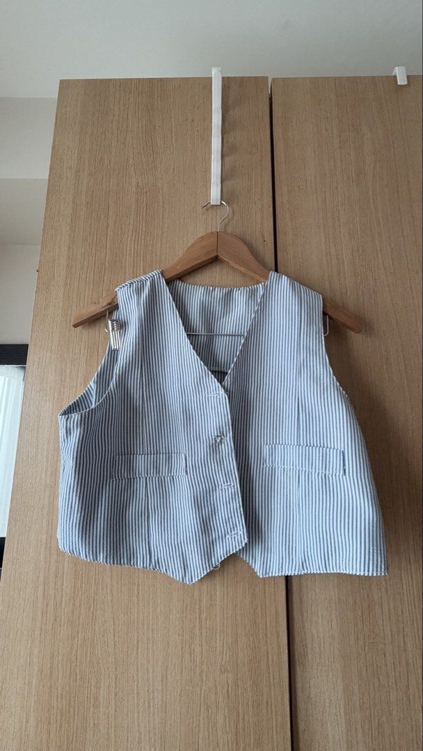 Blue and White Striped Vest and Pants Set (Category: Sets or Coordinates) located in Mandaluyong City. Submitted by andreyamari_ (Listing ID 1471307036, Image 2). Description: - Blue and white vertical stripe matching set - Vest features front buttons and two functional pockets - High-waisted pants with a clean, flattering waistband - Lightweight and breathable material - Easy to style together or mix and match with other pieces.