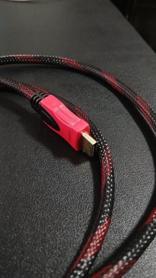 Braided HDMI to VGA Cable Red Black (Category: Cables & Adaptors) located in Pasig City. Submitted by mfumi_official (Listing ID 1471319732, Image 1). Description: - Type: HDMI to VGA display cable - Design: Red and black braided mesh sleeve (no fraying) - Connectors: Gold-plated with protective housing - Interference Reduction: Built-in ferrite cores for stable signal - Condition: Tested, fully operational, and clean connectors - Length: Standar