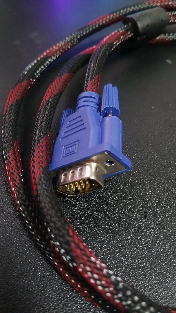 Braided HDMI to VGA Cable Red Black (Category: Cables & Adaptors) located in Pasig City. Submitted by mfumi_official (Listing ID 1471319732, Image 3). Description: - Type: HDMI to VGA display cable - Design: Red and black braided mesh sleeve (no fraying) - Connectors: Gold-plated with protective housing - Interference Reduction: Built-in ferrite cores for stable signal - Condition: Tested, fully operational, and clean connectors - Length: Standar
