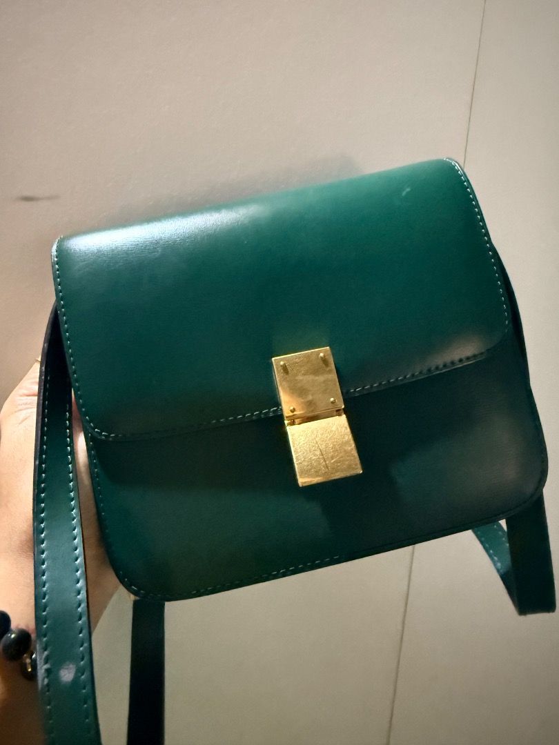 Celine Classic Box Bag Green Leather (Category: Luxury Bags & Wallets) located in Manila. Submitted by _outofthecloset. (Listing ID 1471318107, Image 2). Description: - Brand: Celine Classic Box Bag - Material: Premium smooth leather in a stunning dark green shade - Hardware: Elegant gold-tone closure with stamped Celine Paris logo - Interior: Multiple clean compartments lined with matching leather - Strap: Adjustable leather shoulder strap inclu