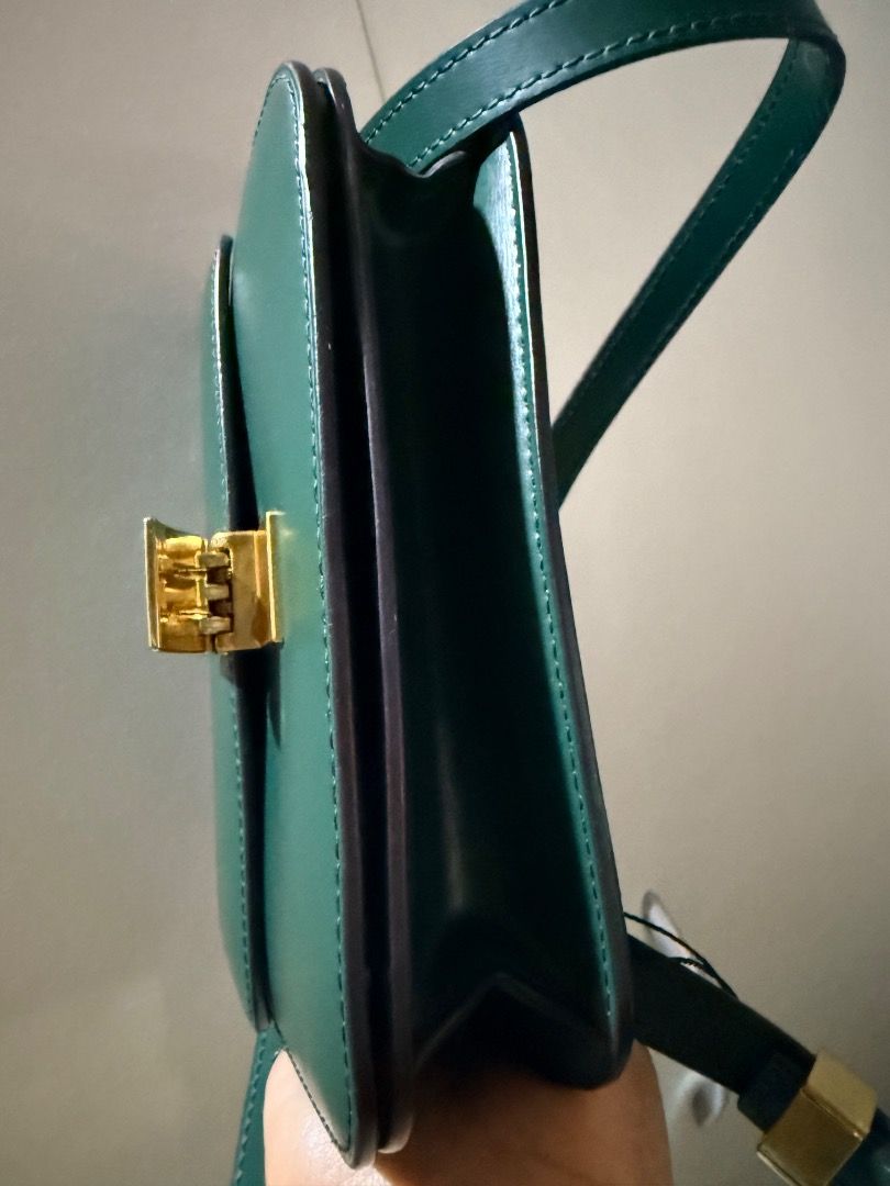 Celine Classic Box Bag Green Leather (Category: Luxury Bags & Wallets) located in Manila. Submitted by _outofthecloset. (Listing ID 1471318107, Image 3). Description: - Brand: Celine Classic Box Bag - Material: Premium smooth leather in a stunning dark green shade - Hardware: Elegant gold-tone closure with stamped Celine Paris logo - Interior: Multiple clean compartments lined with matching leather - Strap: Adjustable leather shoulder strap inclu