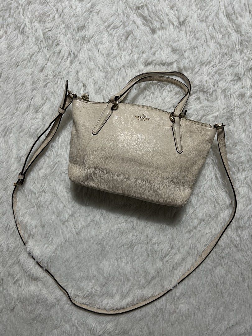 Coach Kelsey Satchel 2-way bag (Category: Luxury Bags & Wallets) located in Quezon City. Submitted by commonwealthpickerph (Listing ID 1471306124, Image 2). Description: Coach Kelsey Satchel 2-way bag 11 width // 7 length - Premium grainy texture leather exterior with gold-tone hardware - Dual top handles plus an adjustable/detachable shoulder strap for versatile wear - Secure zip-top closure to keep your essentials safe - Dark brown fabric-lined