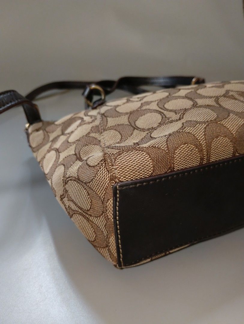 Coach Mini Kelsey Satchel (Category: Luxury Bags & Wallets) located in Cagayan de Oro. Submitted by warmbird-f84aab (Listing ID 1471312170, Image 3). Description: Signature Khaki Canvas × Dark Brown Leather 💰 Price: 650+sf ✨ Clean inside & out | Hardware still shiny ✨ Minor signs of use only — no damage ✨ Comes with hangtag & crossbody strap 📍 Mindanao ⚠️ Mode of payment: Gcash/Cash ⚠️ No return, no exchange — please view all photos before buyi