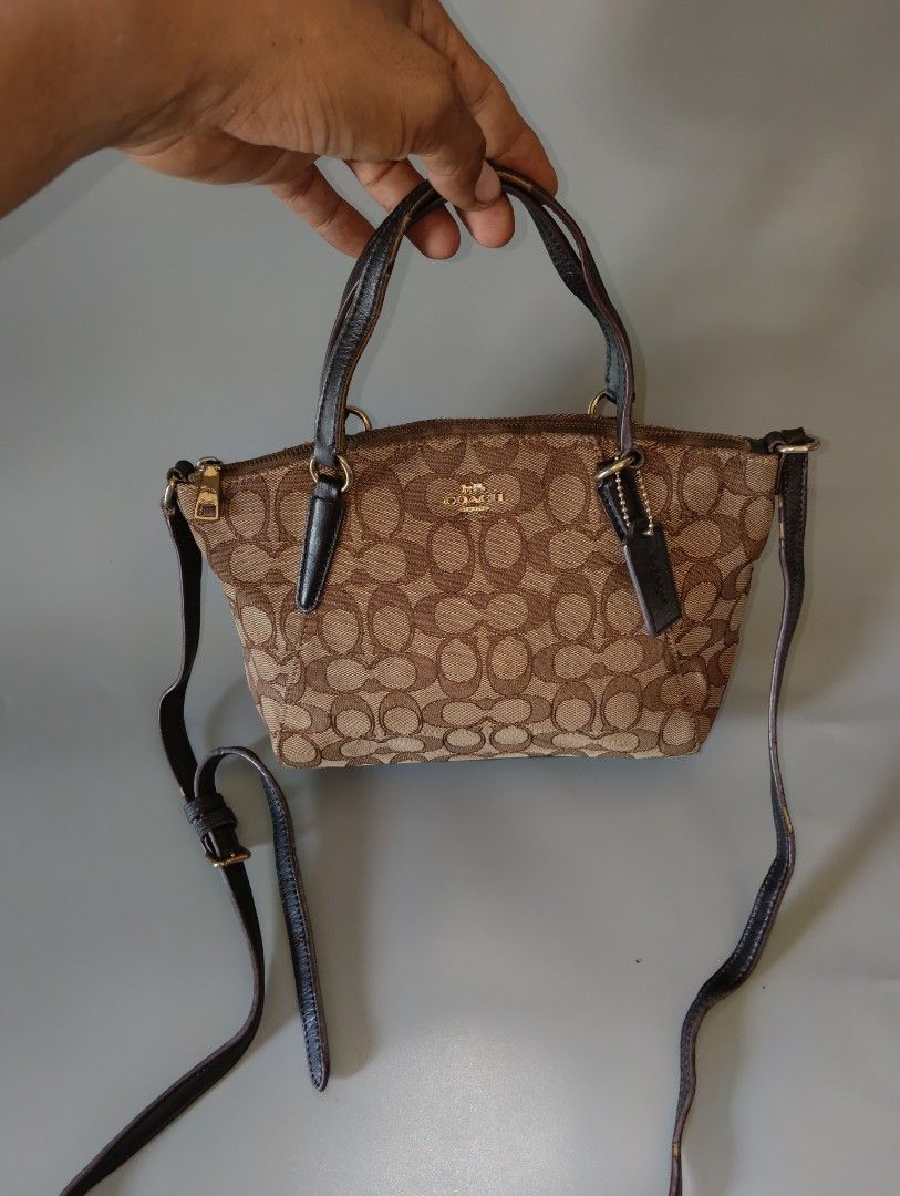 Coach Mini Kelsey Satchel (Category: Luxury Bags & Wallets) located in Cagayan de Oro. Submitted by warmbird-f84aab (Listing ID 1471312170, Image 1). Description: Signature Khaki Canvas × Dark Brown Leather 💰 Price: 650+sf ✨ Clean inside & out | Hardware still shiny ✨ Minor signs of use only — no damage ✨ Comes with hangtag & crossbody strap 📍 Mindanao ⚠️ Mode of payment: Gcash/Cash ⚠️ No return, no exchange — please view all photos before buyi