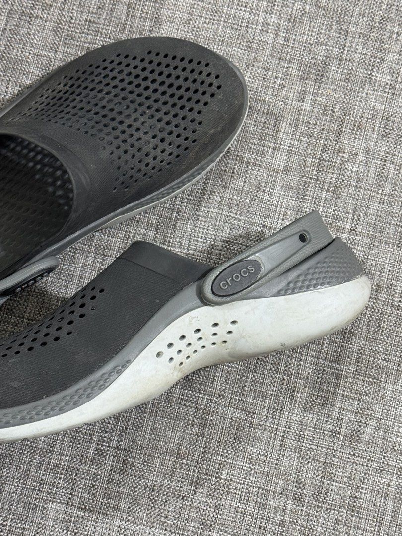 Crocs LiteRide Clogs Grey Size 5 (Category: Slippers & Slides) located in Mandaluyong City. Submitted by fidgetcracker (Listing ID 1471421154, Image 2). Description: - Item: Grey Crocs LiteRide Clogs - Size: 5 - Comfort: Super soft LiteRide foam insoles for all-day wear - Design: Perforated uppers for airflow and adjustable heel straps with Crocs branding - Condition: Pre-loved with some dirt and wear on the soles - Perfect as easy everyday slip-