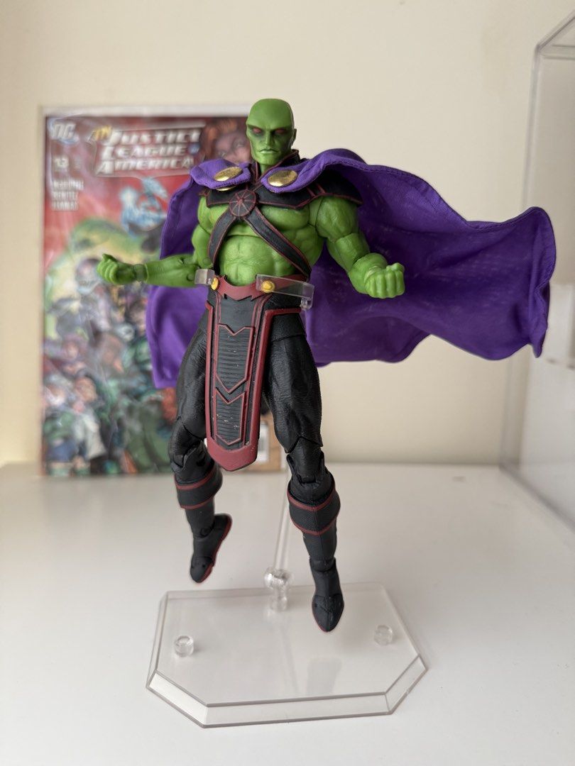 DC Multiverse Martian Manhunter Action Figure with Comic Book (Category: Figurines & Statues) located in Manila. Submitted by easteagle (Listing ID 1471344835, Image 2). Description: WITH FREE DC COMICS! - Green Martian action figure from the Justice League series - Fully poseable joints for dynamic displays - Features a premium wired purple fabric cape - Includes a plastic display stand - Bundle comes with Justice League of America #13 comic boo