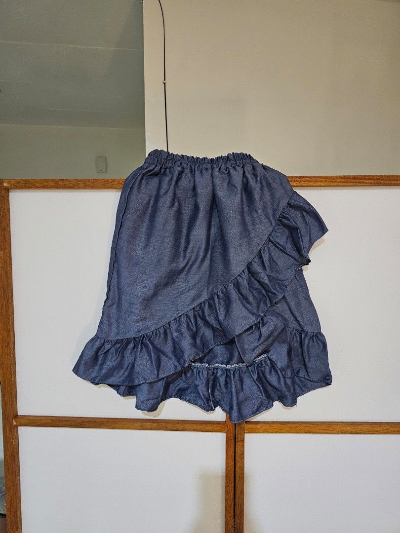 Denim Ruffle Skirt (Category: Skirts) located in Quezon City. Submitted by moanascloset (Listing ID 1471311327, Image 1). Description: - Style: Denim look tiered ruffle skirt - Waistband: Comfy elastic for easy slip-on - Occasion: Great casual piece for everyday wear .