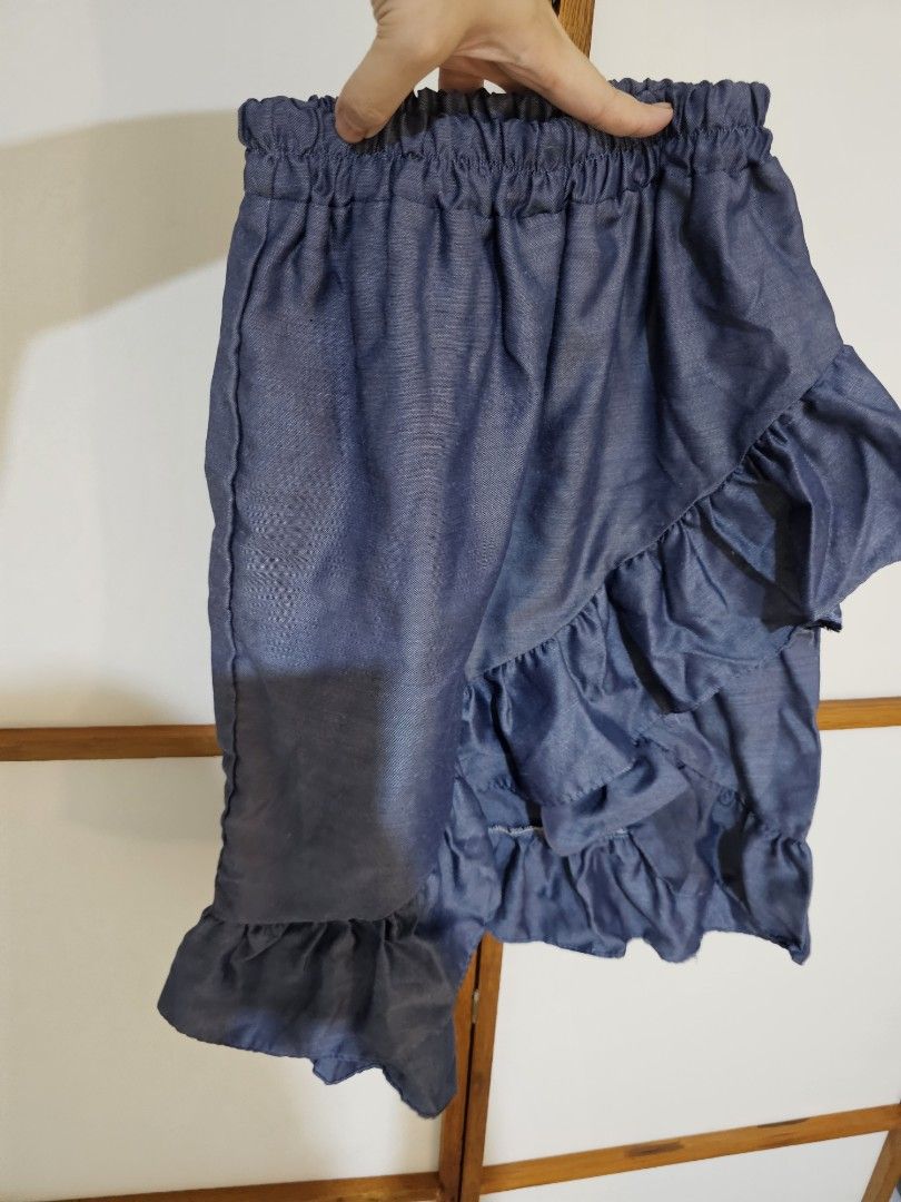 Denim Ruffle Skirt (Category: Skirts) located in Quezon City. Submitted by moanascloset (Listing ID 1471311327, Image 2). Description: - Style: Denim look tiered ruffle skirt - Waistband: Comfy elastic for easy slip-on - Occasion: Great casual piece for everyday wear .