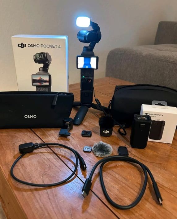 DJI Osmo Pocket 4 Creator Combo with Accessories (Category: Cameras) located in Caloocan City. Submitted by quickstone5522 (Listing ID 1471412471, Image 1). Description: - DJI Osmo Pocket 4 camera setup (Creator Combo) - Includes mini tripod base and attachable light module - Wireless microphone with deadcat windscreen included - Extra battery pack for extended shooting - Comes with multiple USB-C cables, storage pouches, and original retail box 