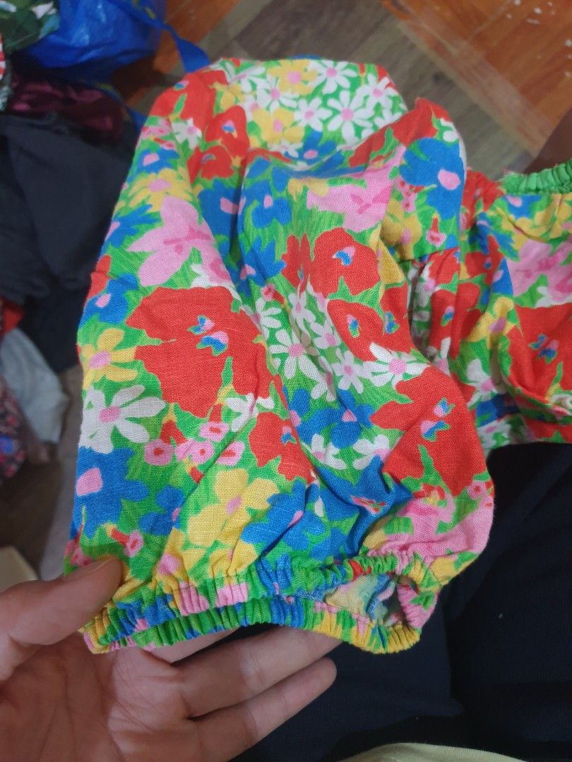 Floral Print Puff Sleeve Crop Top (Category: Blouses) located in Manila. Submitted by marikit16 (Listing ID 1471382203, Image 3). Description: - Style: Floral print crop top with short puff sleeves and square neckline - Design: Colorful all-over red, blue, green, and yellow flower pattern - Fit: Pairs perfectly with high-waisted denim jeans - Occasion: Great statement piece for sunny days out or casual lakwatsas - Condition: like new.