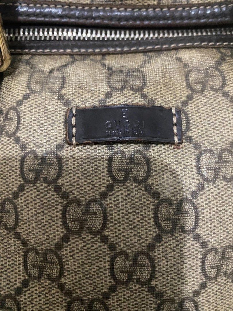 Gucci GG Supreme Boston Bag (Category: Luxury Bags & Wallets) located in Manila. Submitted by garmentfinds.01 (Listing ID 1471345484, Image 3). Description: - Authentic Gucci duffel bag in classic GG monogram canvas - Features double dark leather top handles and matching trim - Secure top zipper closure with gold hardware zipper pull - Fabric-lined interior complete with leather Gucci stamp tag - Condition: Shows some signs of wear on the canvas 