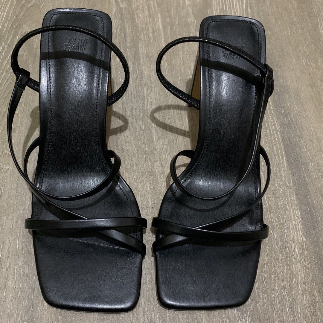 H&M Black Strappy Heeled Sandals (Category: Heels) located in Quezon City. Submitted by itscxyy (Listing ID 1471356233, Image 2). Description: - Brand: H&M - Style: Black strappy heels with square toe and ankle strap - Heel: Chunky block heel for great stability - Condition: Worn 1-2x, super clean soles and insoles with minimal wear - Best for: Parties, events, and night outs.