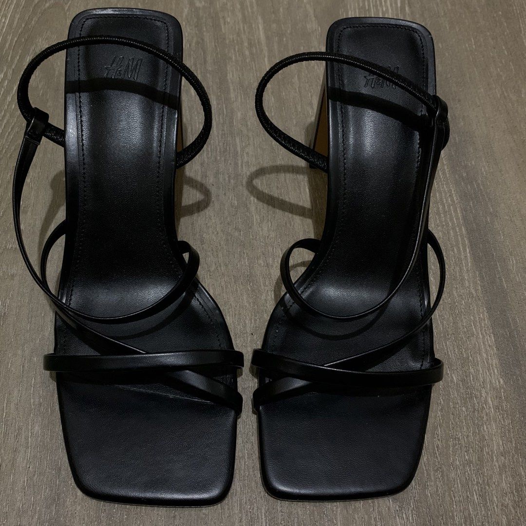 H&M Black Strappy Heeled Sandals (Category: Heels) located in Quezon City. Submitted by itscxyy (Listing ID 1471356233, Image 1). Description: - Brand: H&M - Style: Black strappy heels with square toe and ankle strap - Heel: Chunky block heel for great stability - Condition: Worn 1-2x, super clean soles and insoles with minimal wear - Best for: Parties, events, and night outs.