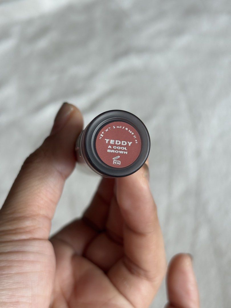 Issy Lip Moussed Tint in Teddy (Category: Makeup) located in Quezon City. Submitted by haha10_4 (Listing ID 1471343191, Image 2). Description: - Brand: Issy Hydragloss - Shade: Teddy (cool brown tone) - Size: Net weight 5ml / 0.169 fl oz - Packaging: Sleek silver with embossed logo and easy-twist cap - Perfect everyday neutral lip shade - Swatched only.