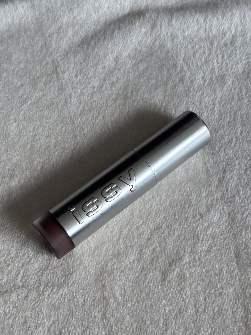 Issy Lip Moussed Tint in Teddy (Category: Makeup) located in Quezon City. Submitted by haha10_4 (Listing ID 1471343191, Image 1). Description: - Brand: Issy Hydragloss - Shade: Teddy (cool brown tone) - Size: Net weight 5ml / 0.169 fl oz - Packaging: Sleek silver with embossed logo and easy-twist cap - Perfect everyday neutral lip shade - Swatched only.