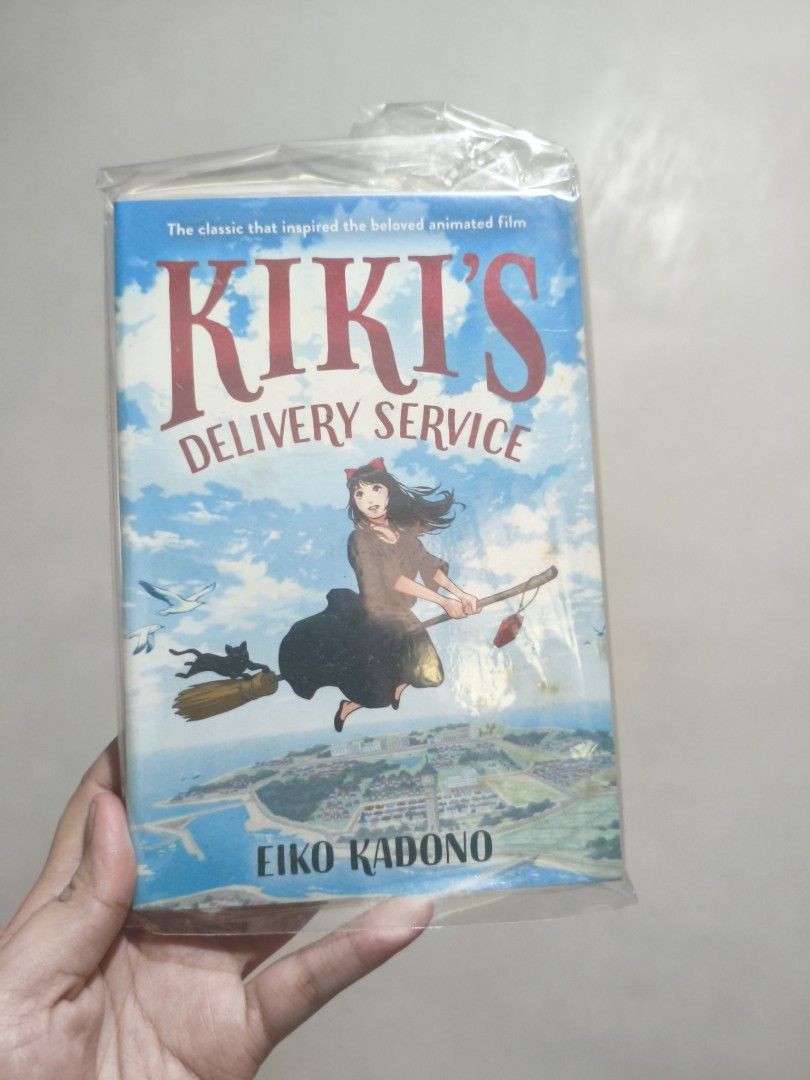 Kiki's Delivery Service by Eiko Kadono paperback (Category: Storybooks) located in Pasig City. Submitted by readernotwriter (Listing ID 1471329257, Image 1). Description: - Title: Kiki's Delivery Service - Author: Eiko Kadono - Edition: English paperback - Condition: Wrapped in protective plastic cover, spine intact, clean text inside - Note: The classic book that inspired the famous animated film!.