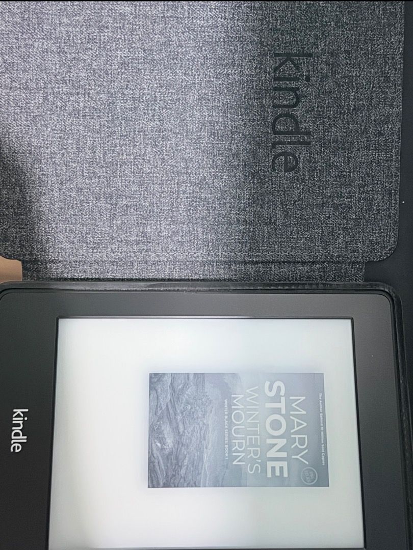 Kindle Paperwhite with case (6") (Category: E-Readers) located in Santa Rosa. Submitted by biancamarie0404 (Listing ID 1471340199, Image 2). Description: - Fully functional Amazon Kindle e-reader with a crisp touchscreen and clear e-ink text - Great battery life with a visible percentage indicator at the top right - Includes a textured black leather folio case with a secure magnetic closure tab - Adjustable font sizes and built-in store menus for