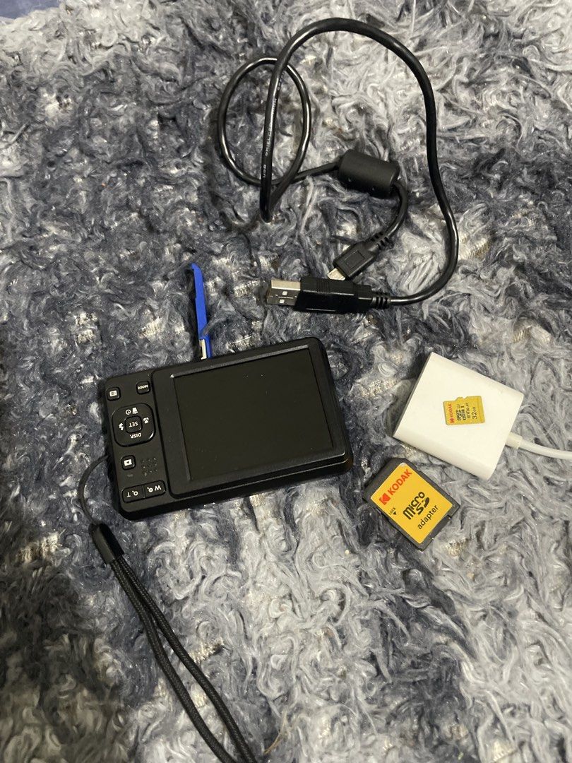 Kodak Pixpro FZ55 Blue Digital Camera Bundle (Category: Cameras) located in Rodriguez. Submitted by pol_198917 (Listing ID 1471319552, Image 2). Description: - Model: Blue Kodak Pixpro digital camera in great working shape - Condition: Fully functional with a clear screen and handy attached wrist strap - Features: 5x wide zoom lens and Full HD video recording - Portability: Compact size, easy to toss in a bag - Inclusions: 32GB Kodak microSD card