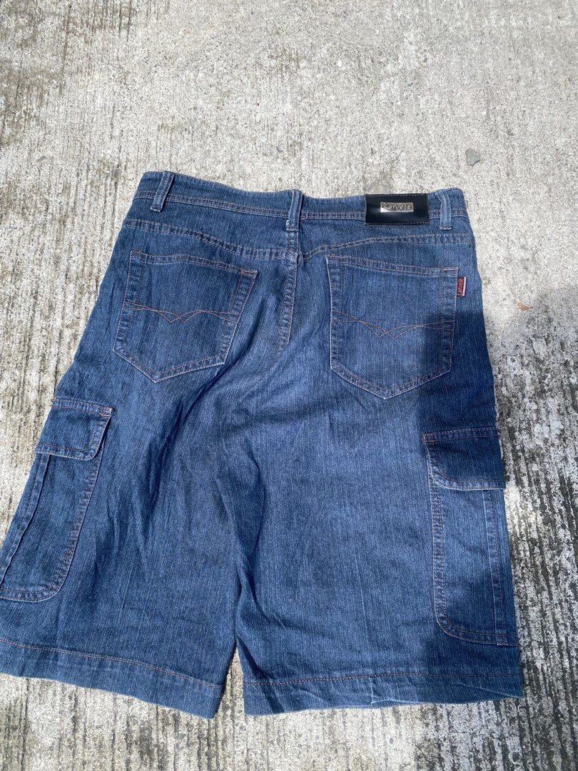 LAFOELE wash denim cargo shorts (Category: Shorts) located in Manila. Submitted by mystic.enrique_romulo (Listing ID 1471328741, Image 1). Description: - Style: Dark wash denim cargo shorts with a straight fit - Details: Eye-catching orange contrast stitching and branded patch on the back waistband - Pockets: Multiple utility side pockets and classic back pockets - Closure: Secure button closure with built-in belt loops - Material: Structured 100