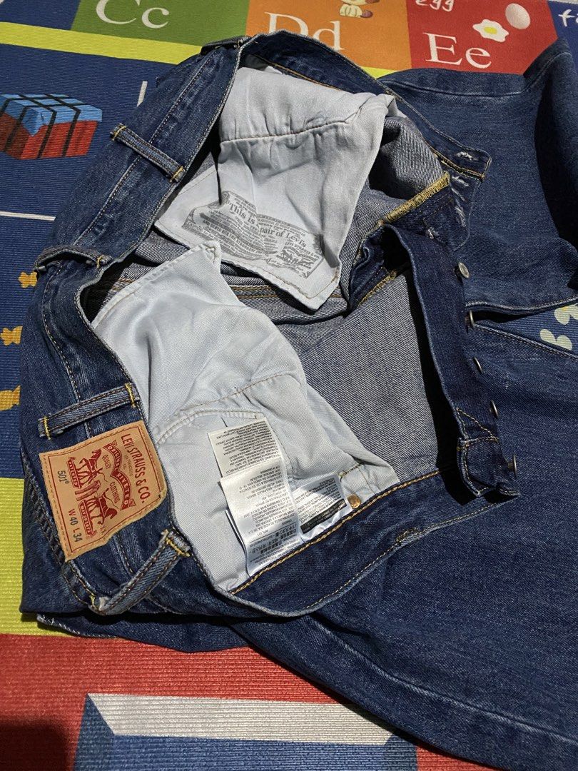 Levi's 501 Original Fit Jeans (Category: Jeans) located in Manila. Submitted by tygaangub1096 (Listing ID 1471316667, Image 2). Description: - Brand: Levi's 501 Original Fit Jeans - Size: W40 L34 on tag (L46 actual dimes) - Color: Clean dark indigo wash with contrast stitching - Material: Sturdy, durable cotton denim - Features: Classic button fly, 5-pocket styling, and signature leather back patch - Fit: Straight leg cut - Add shipping fee.