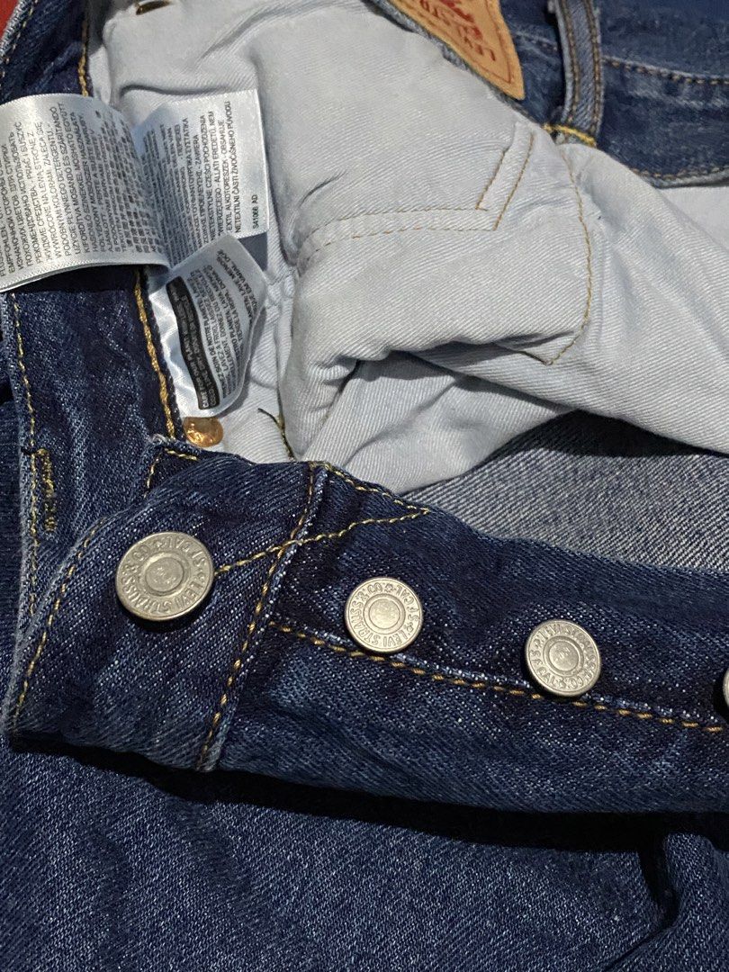 Levi's 501 Original Fit Jeans (Category: Jeans) located in Manila. Submitted by tygaangub1096 (Listing ID 1471316667, Image 3). Description: - Brand: Levi's 501 Original Fit Jeans - Size: W40 L34 on tag (L46 actual dimes) - Color: Clean dark indigo wash with contrast stitching - Material: Sturdy, durable cotton denim - Features: Classic button fly, 5-pocket styling, and signature leather back patch - Fit: Straight leg cut - Add shipping fee.