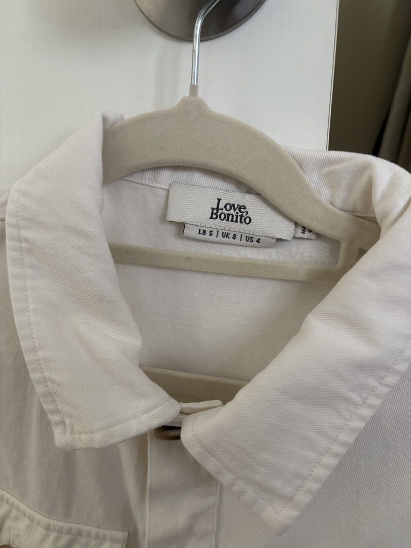 Love Bonito Breia Cotton Twill Boxy Jacket (Category: Coats, Jackets and Outerwear) located in Taguig. Submitted by user51982 (Listing ID 1471319874, Image 2). Description: - Brand: Love Bonito - Item: Breia Cotton Twill Boxy Jacket - Color: White - Size: S (Fits UK 8 / US 4) - Material: Structured cotton twill - Design: Cropped length, classic collar, tortoise shell front buttons, two chest pockets, long sleeves with button cuffs - Style: Clean,