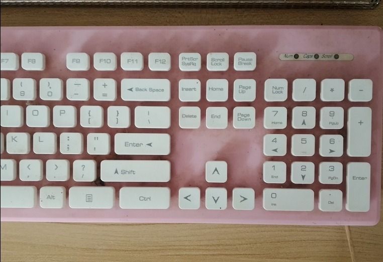 MicroPack Pink and White Mechanical Keyboard (Category: Computer Keyboard) located in Roxas City. Submitted by demalatagiboy (Listing ID 1471392146, Image 3). Description: - Brand: MicroPack - Design: Pink frame with white keycaps and full numpad (Standard QWERTY layout) - Connection: Wired - Condition: Fully functional, shows minor dust and marks around the keys from normal use - Ideal for: Typing, work, or gaming desk setups.